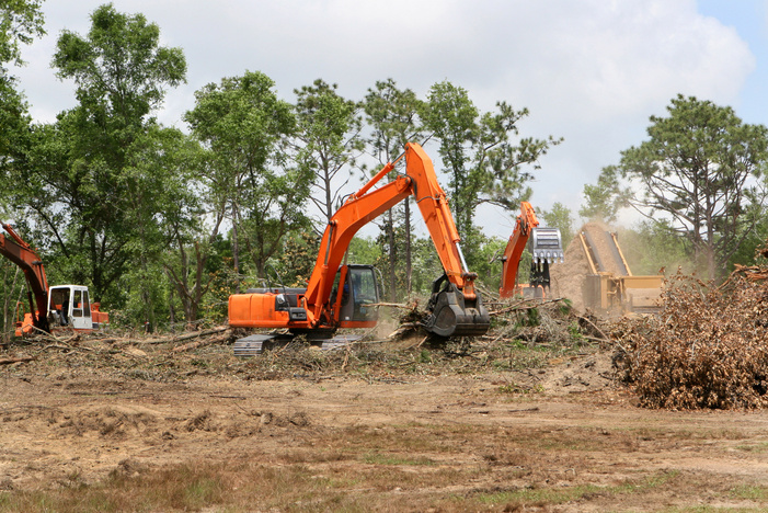 Backhoes Clearing Land