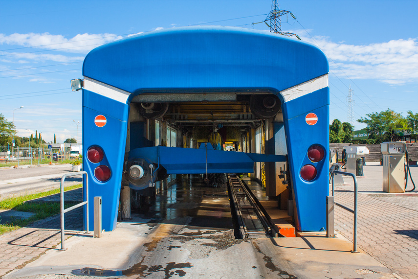 Automated portal carwash with a car running through.